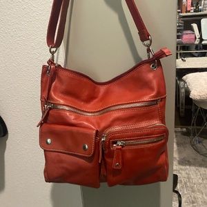 Burnt red fossil leather purse.
